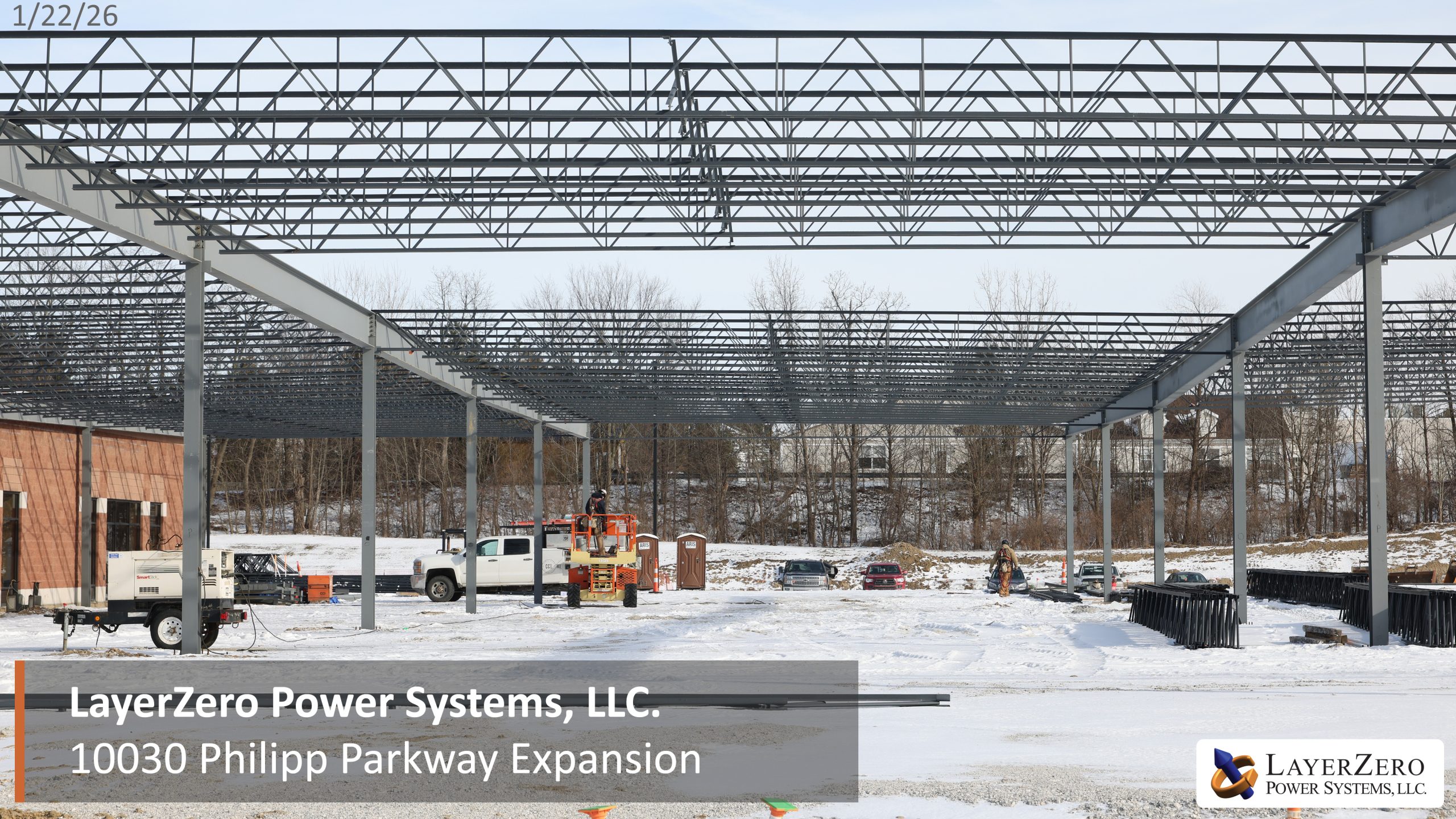 Steel framing under construction at LayerZero Power Systems facility expansion in winter conditions