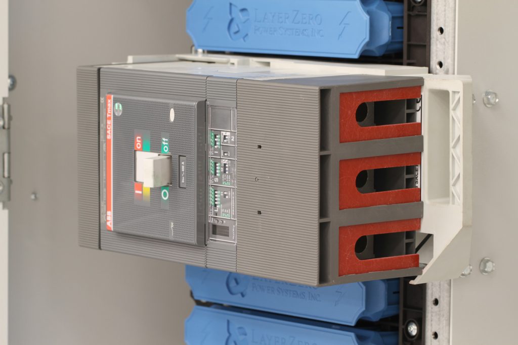 Circuit breaker with insulated fiberglass terminal inserts installed in LayerZero® SafePanel assembly