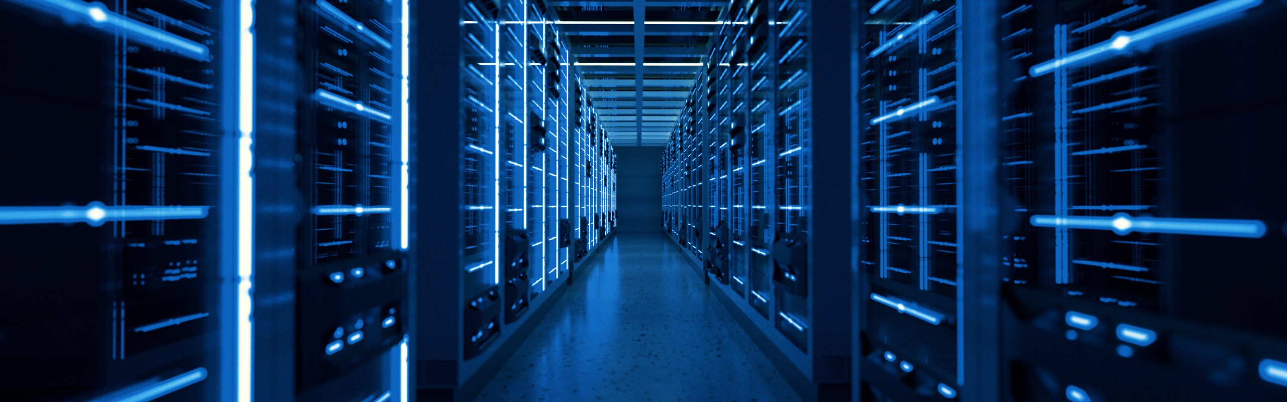 Blue-lit data center server racks in a modern high-density computing facility