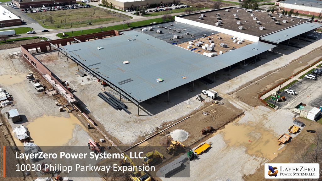 Aerial view of the LayerZero Power Systems Philipp Parkway expansion with roof installation and large-scale construction progress