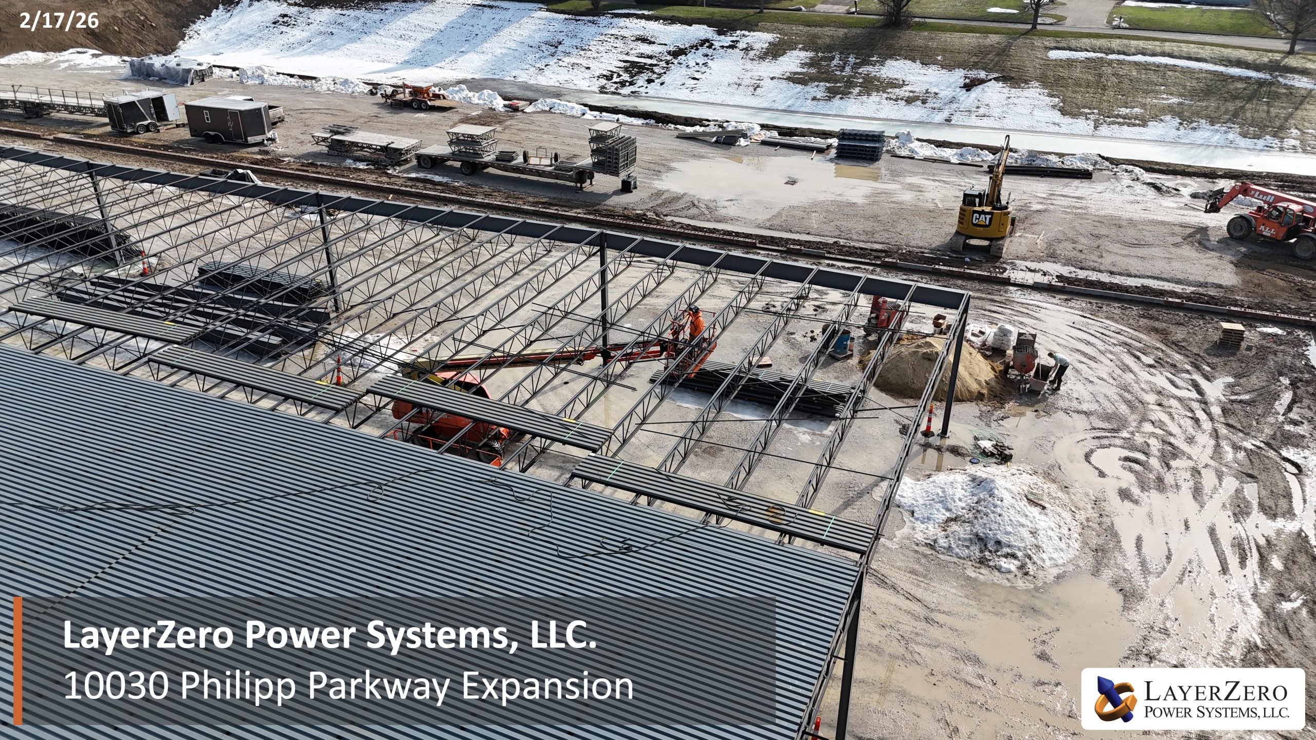 Aerial view of steel framing and roof decking installation at LayerZero Power Systems, LLC expansion site