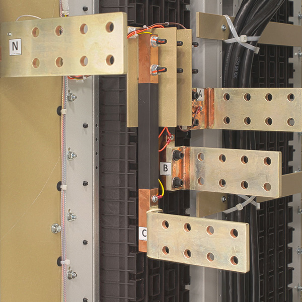 Silver-plated copper busbar connections inside LayerZero® power distribution equipment showing phase and neutral electrical terminations.